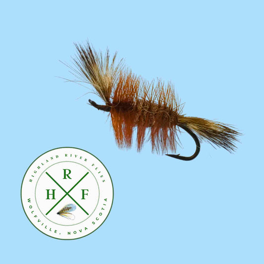 Fishing fly with brown and black details on a blue background, featuring the RHF logo.